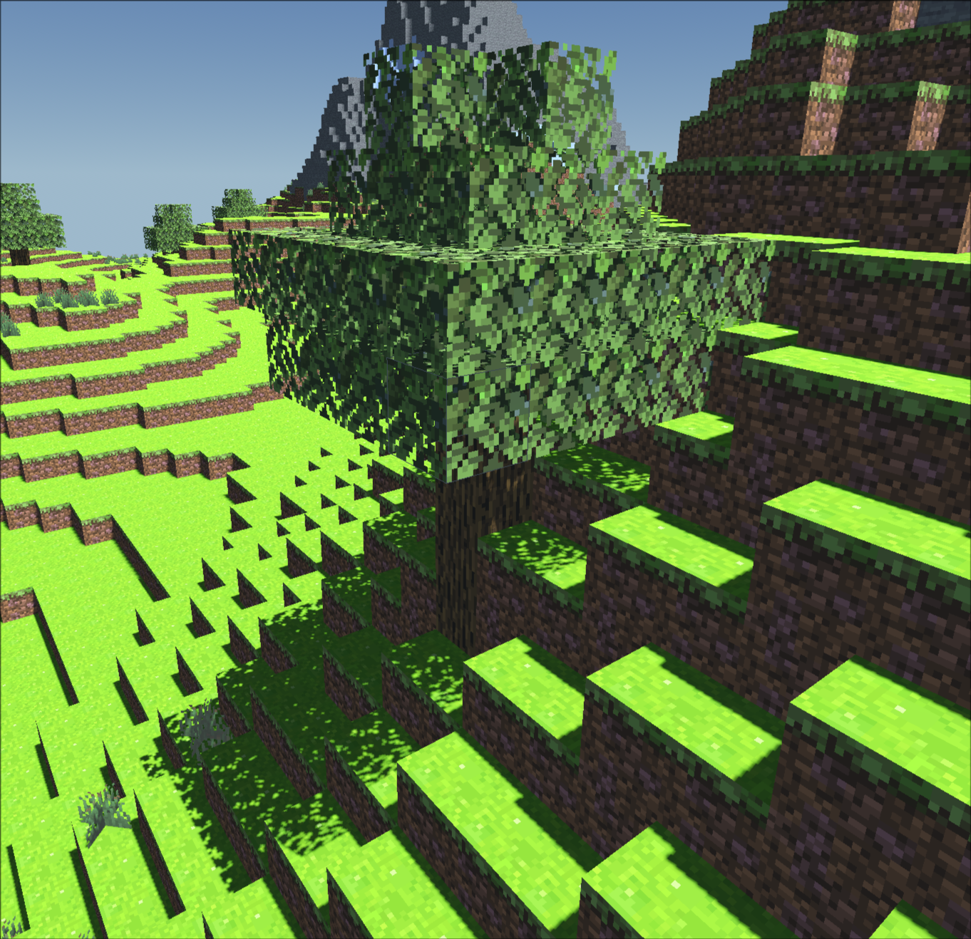 Screenshot of Minecraft clone, showing tall mountains with patches of ice emerging from grassy hills, taken from
                              in front of a tree.